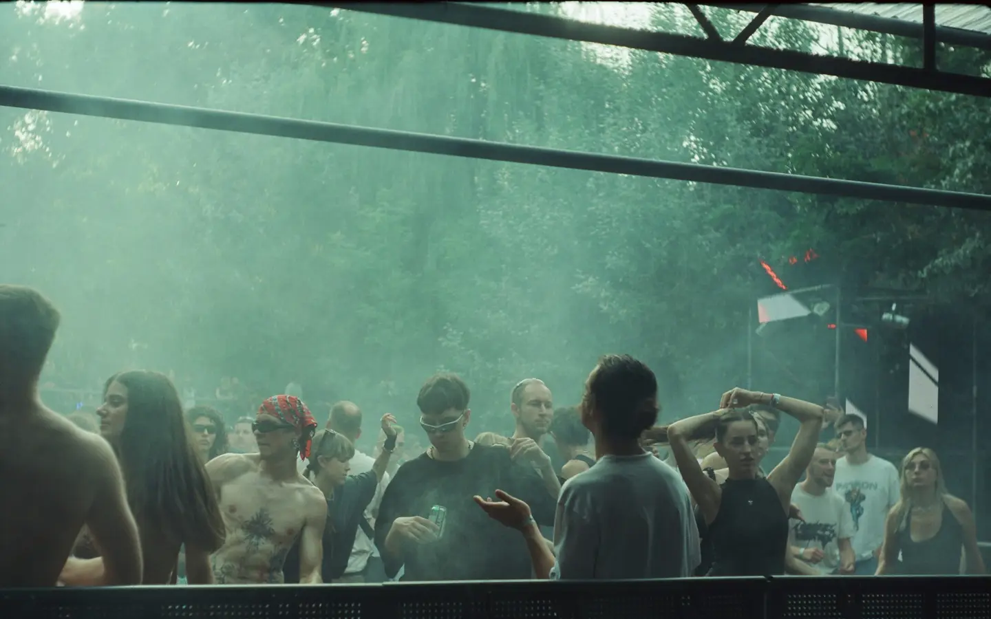 A dense crowd gathered at an outdoor music festival